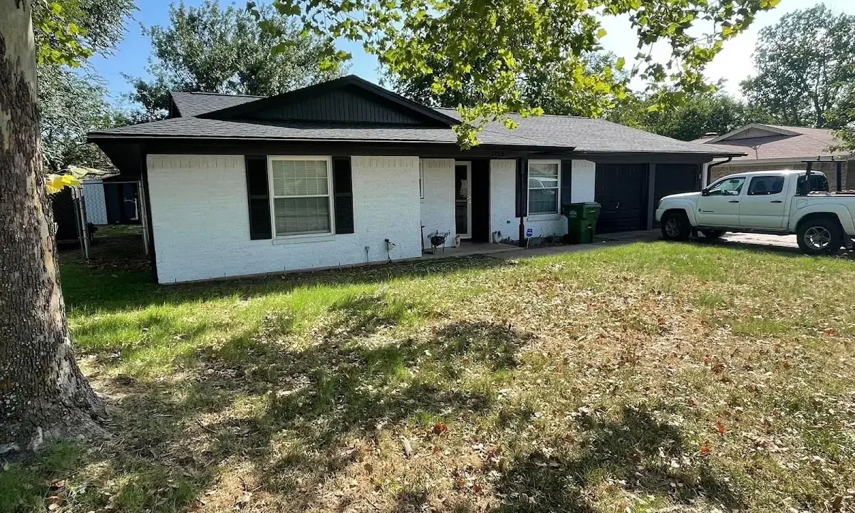 Professional roofing crew working on a residential roof in Lewiston
